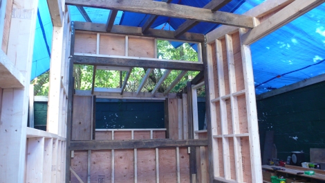 A small awning window will fit in that rough opening